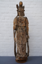 A tall Chinese carved wood figure of Guanyin, Ming